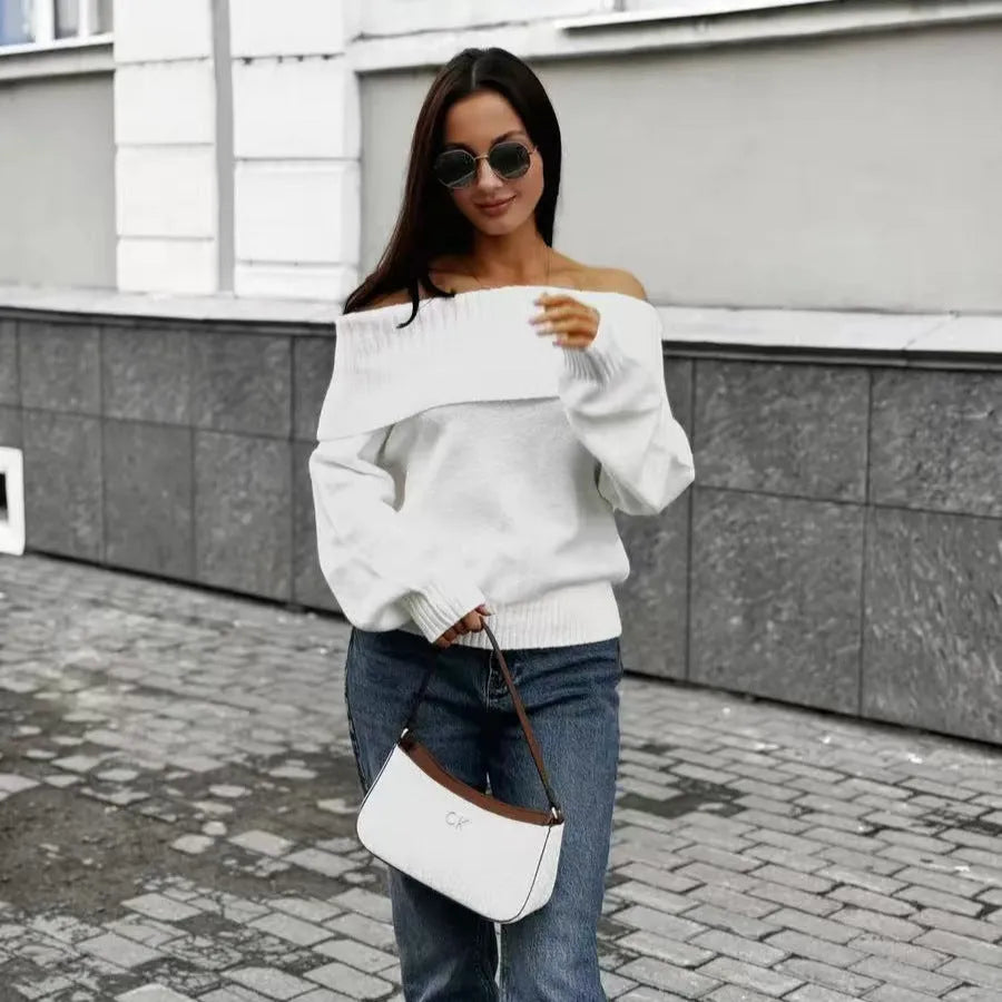 Grey off-the-shoulder acrylic sweater with a 3D pattern texture, modelled from the front.