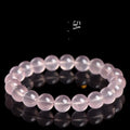 Natural starlight crystal round bead bracelet in pink with polished finish showing bead detail