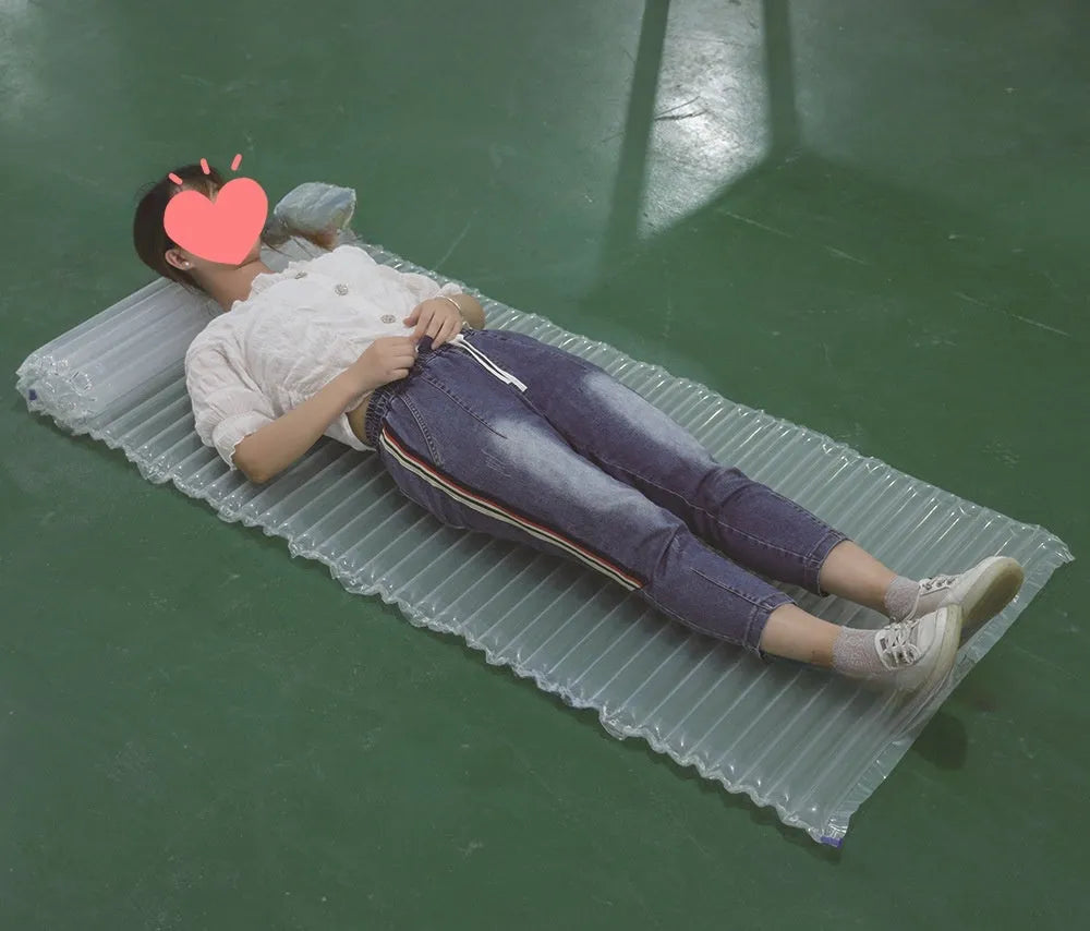 Outdoor camping airbed 200x60x5cm transparent inflatable sleeping mat on green grass