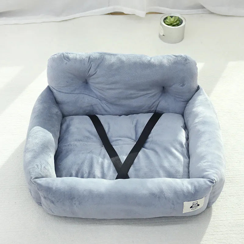 Grey and blue plaid car-mounted removable pet travel nest for dogs on a car seat