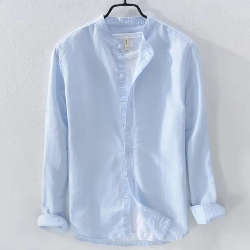 Man's loose-fit long sleeve casual shirt in linen-cotton blend, shown in dark blue colour.
