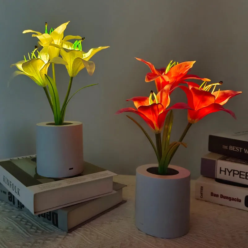 Rechargeable LED lily flower pot lamp in lily-pink colour, flower shape, on tabletop