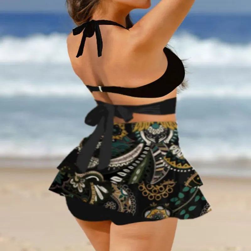 Women's black lace-up bikini with a matching high-waisted split skirt.
