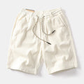 Men's khaki cargo shorts with a straight-leg fit and street style design.