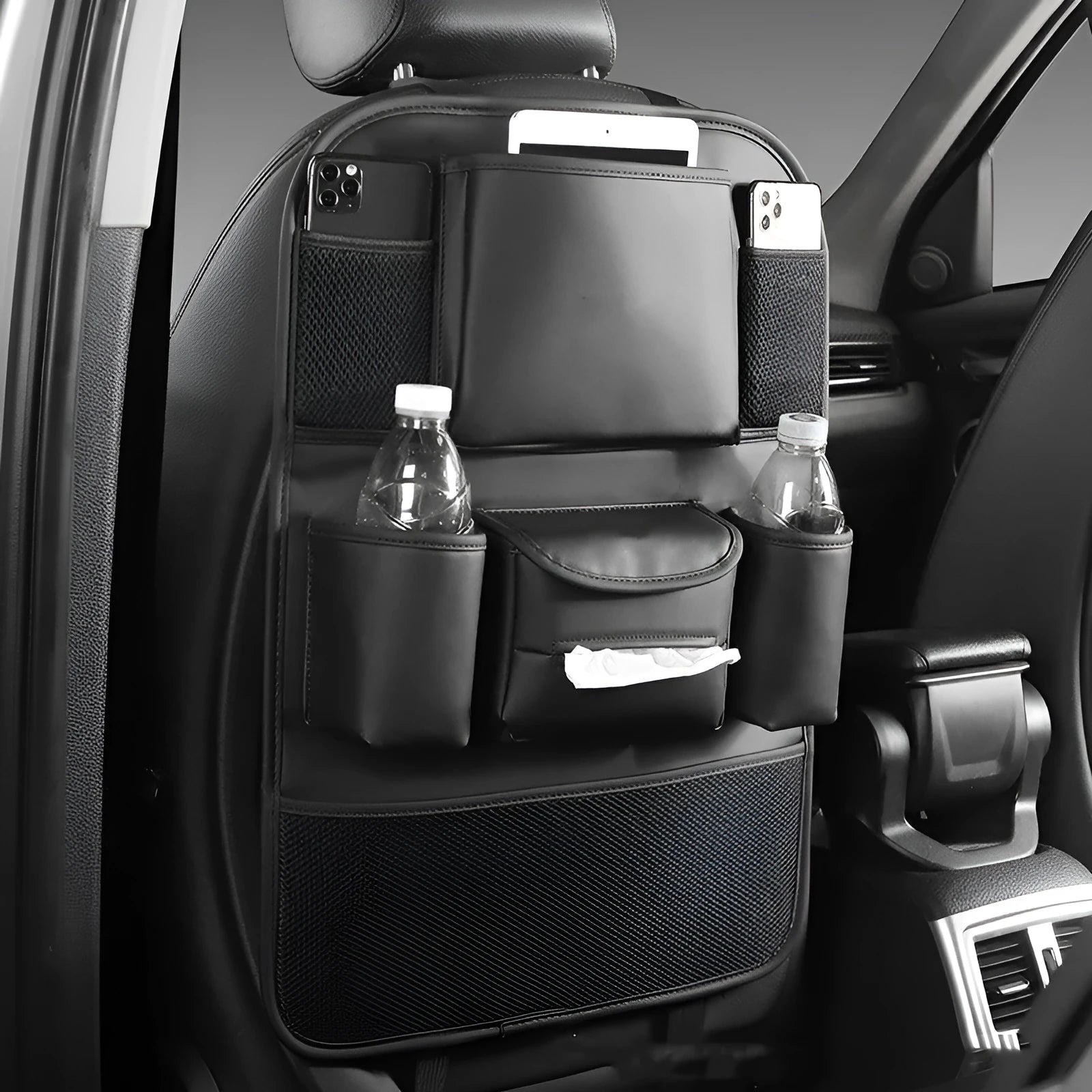 Leather car seat back storage bag in black colour mounted behind vehicle seat