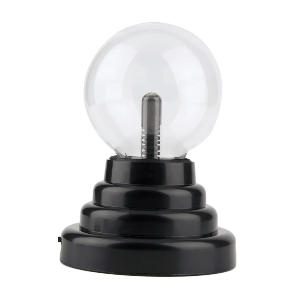 Anti-radiation magic ball light with colourful glow, 7.62cm glass sphere and ABS base on a desk