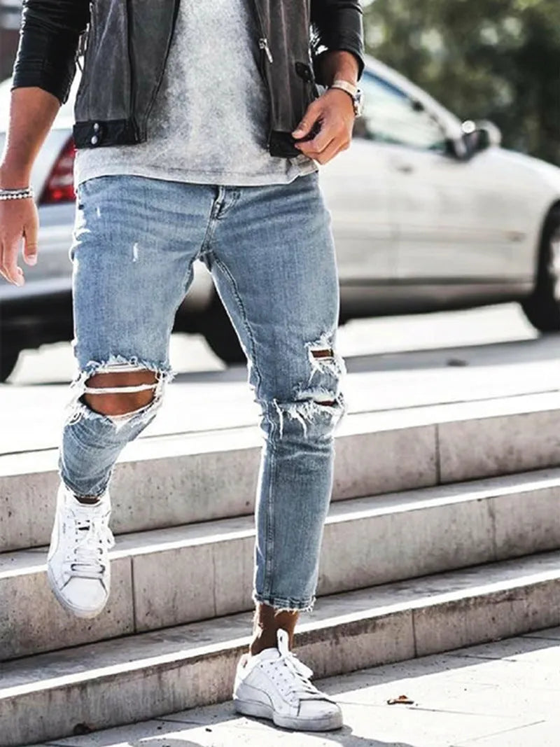 Men's light blue straight fit jeans with worn and embroidered detailing, five-point length, mid-rise waist