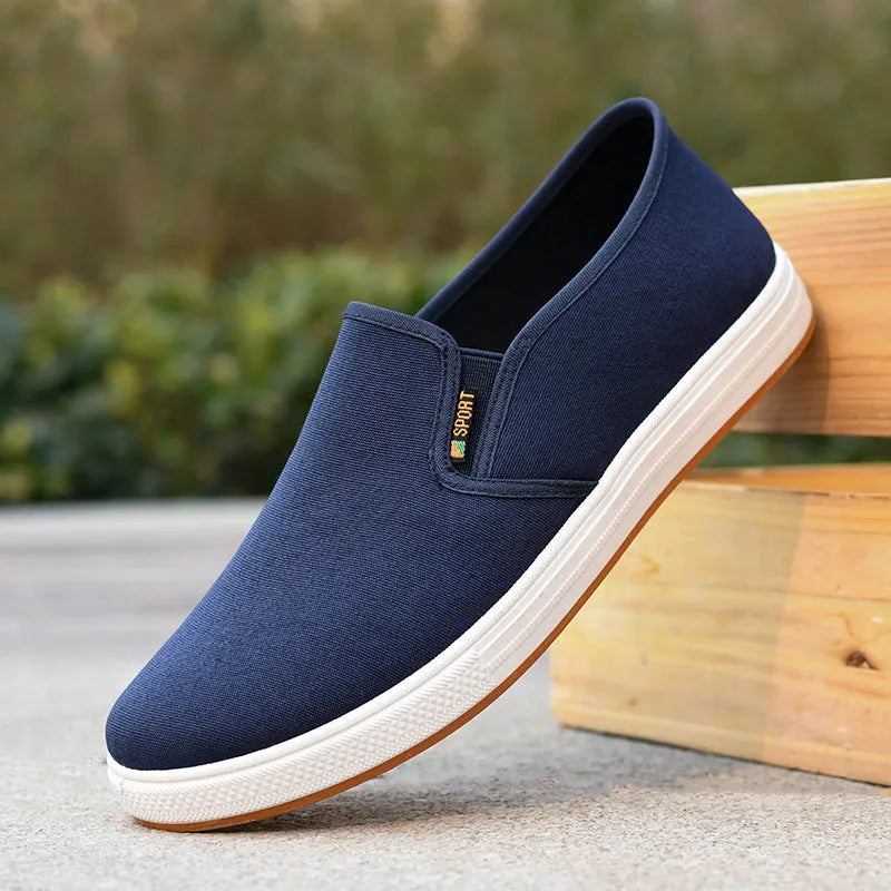 Men's black canvas slip-on shoes with round toe and injection-moulded sole