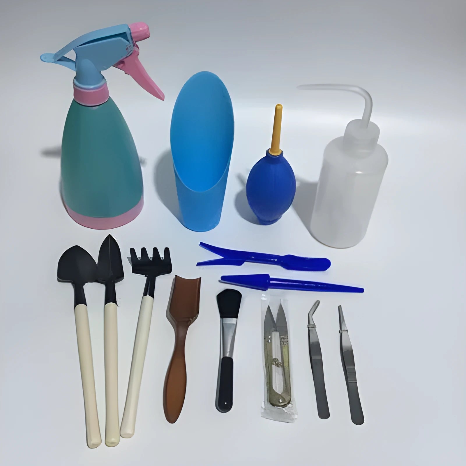 14-piece succulent gardening tool set showing watering can, mini tools, tweezers, brush and scissors for plant care