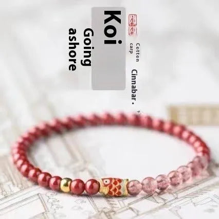 Close-up of a women's bracelet with purple cinnabar and pink strawberry quartz beads in a retro design.