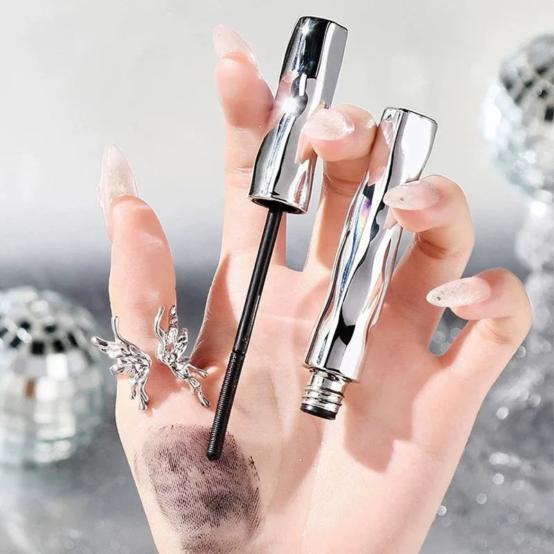 Steel tube waterproof mascara in black and brown shades shown with an eyelash curler.