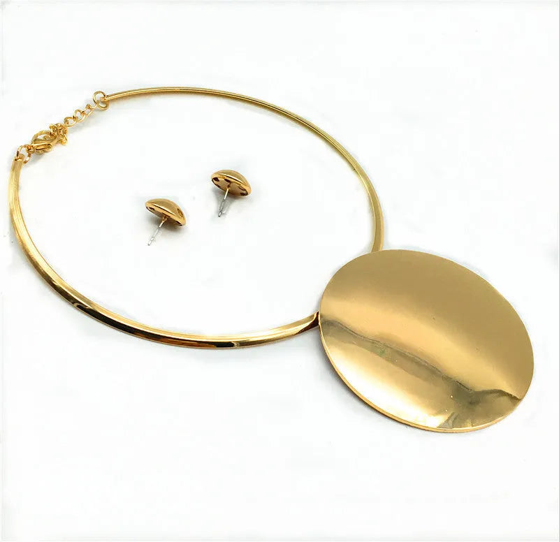 Gold alloy bead pendant necklace set on display with exaggerated design