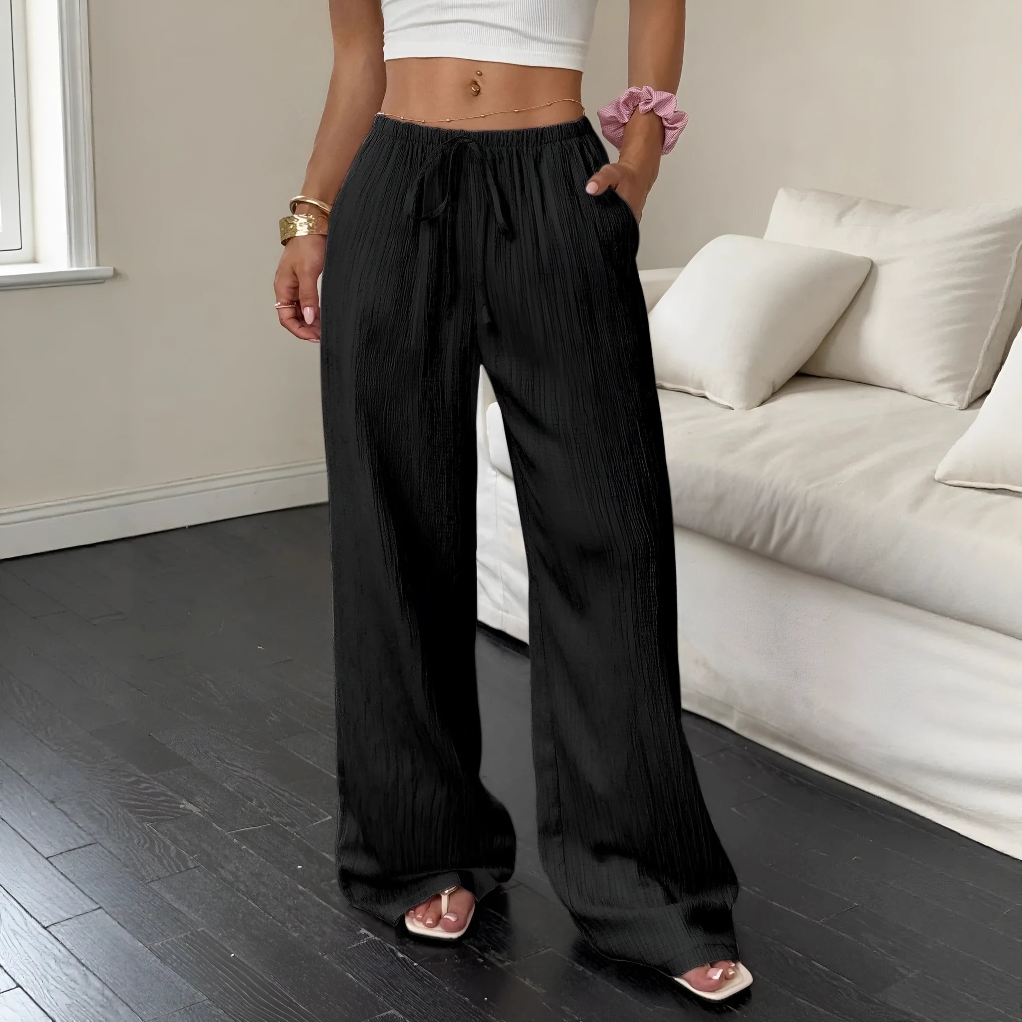 Women's black wide-leg trousers with lace-up waist detail on mid waist