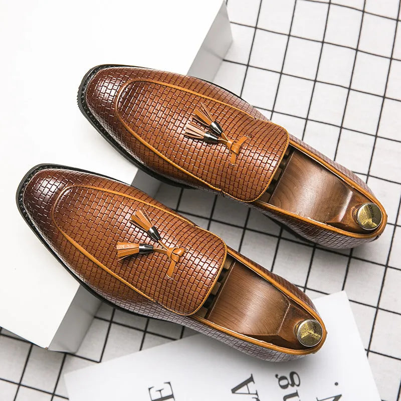 Men's black pointed slip-on shoes with tassel detail on artificial PU upper