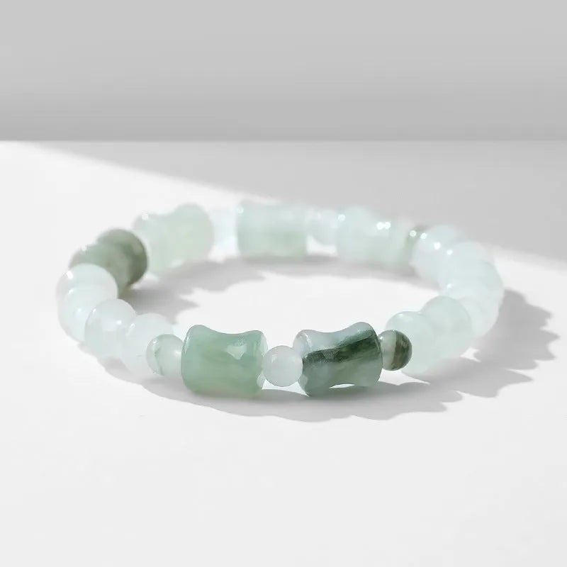 Tianshan Emerald natural chalcedony beaded bracelet with diamond jade centre and coconut shell beads on a white background