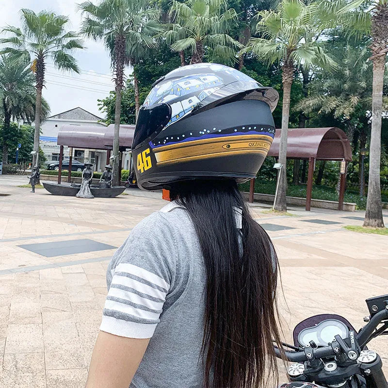 Men's and women's winter motorcycle helmet with ABS shell in dragon graphic colour on white background
