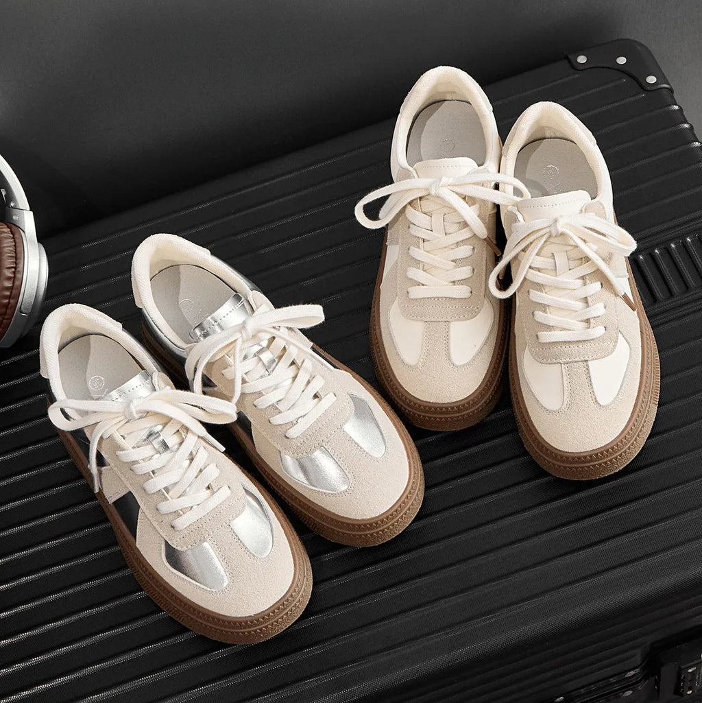 Retro round toe casual board shoes with cross shoulder straps, shown in milky white colour.