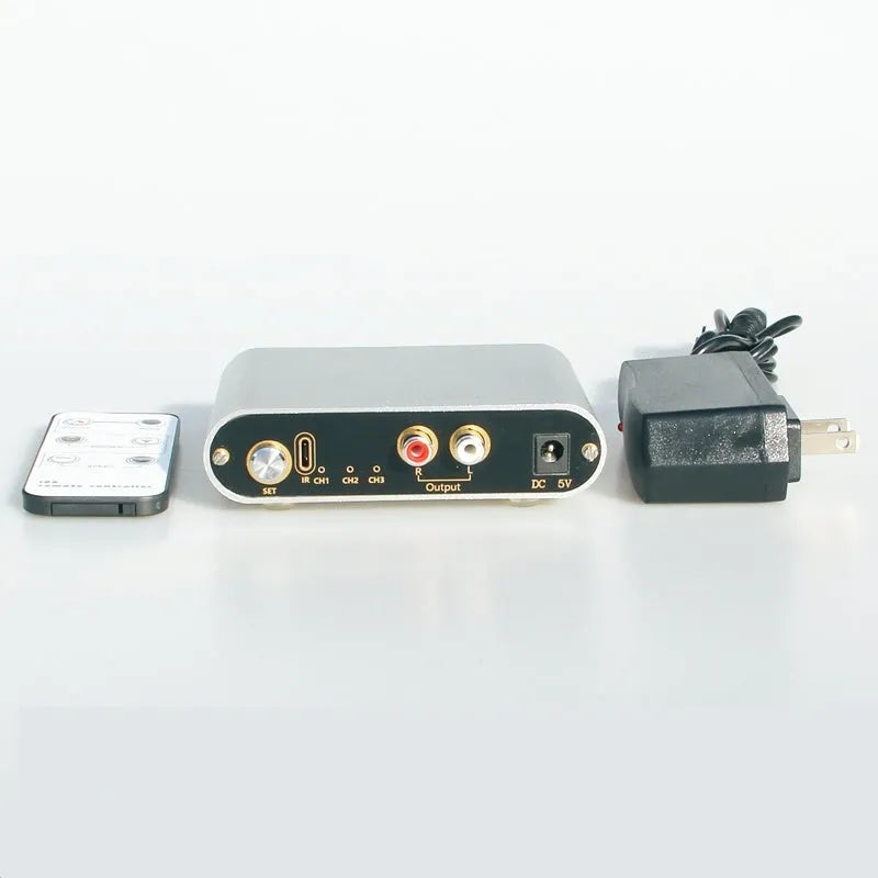 Silver audio source switch with infrared remote control, aluminium alloy shell, front panel buttons and indicator lights, US model