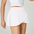 Women's solid colour quick-dry sports shorts in nylon with spandex lining, shown in multiple colours.