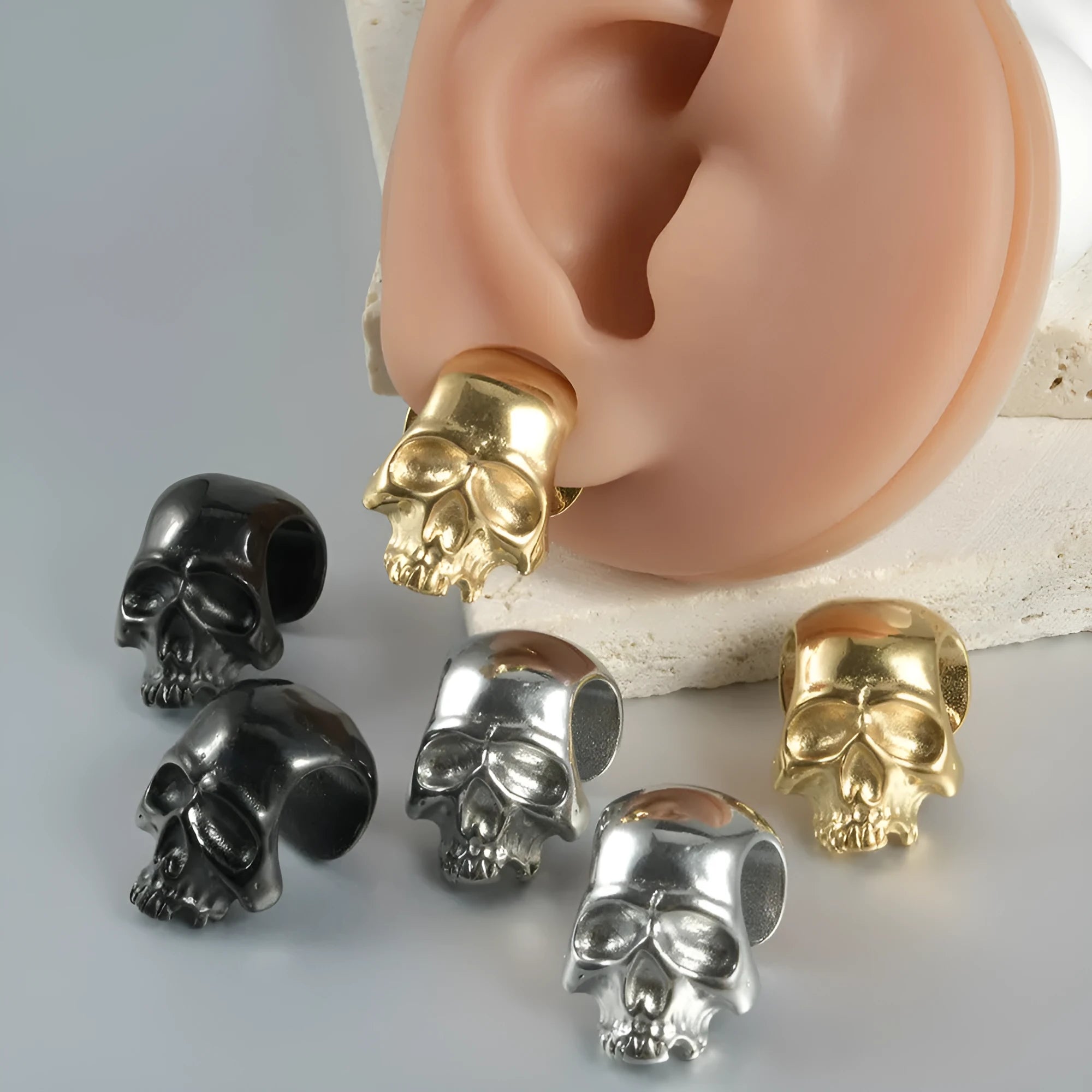 Stainless steel hollow skull Buddha earrings with geometric design in electroplated colours