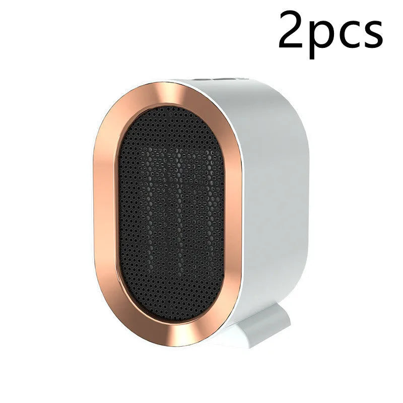 Black desktop electric mini fan heater with PTC ceramic heating on a table, 220V, for home office use