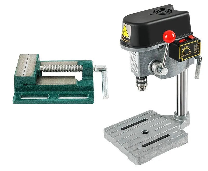 Bench drill and milling machine with cross bench pliers on workbench