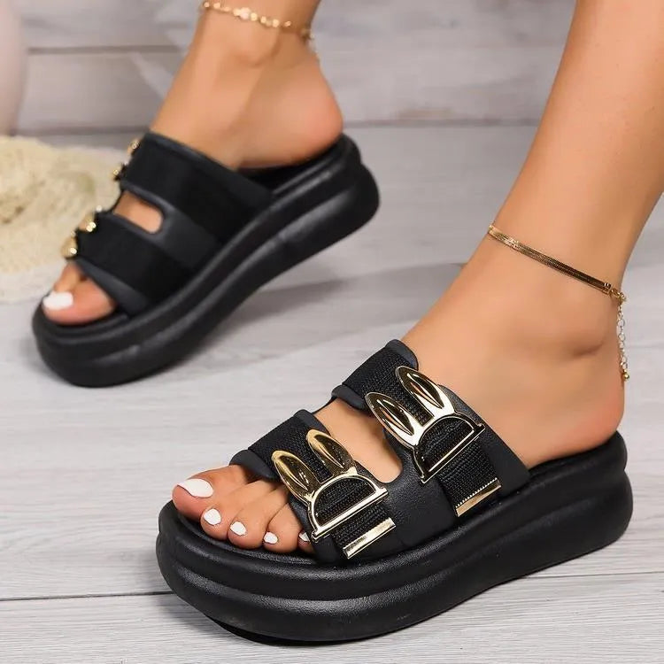 Women's apricot suede slippers with a thick light-coloured rubber sole, shown from the side.