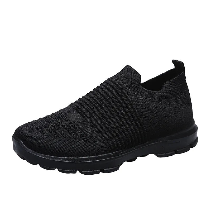 Women's knit sock shoes in beige with breathable upper, round toe, and low rubber sole