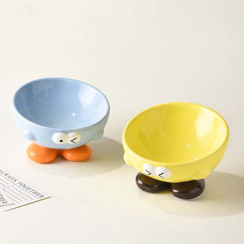 Oblique ceramic cat food bowl with cute expression print in blue for cervical spine protection