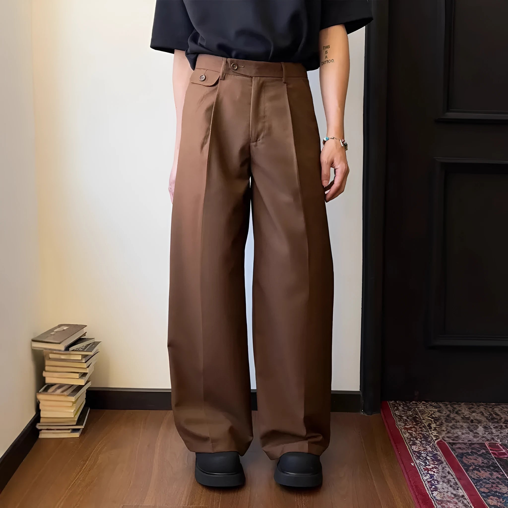 Men's brown straight-leg loose wide-leg casual suit trousers laid flat.