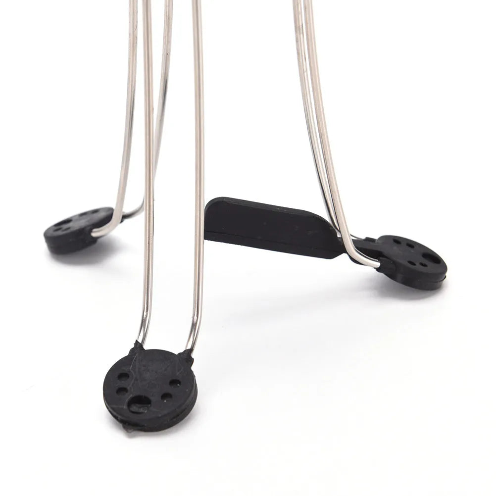 White and black wireless stir crazy mixer with stainless steel shaft on a kitchen countertop
