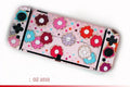 PC hard case for Nintendo Switch OLED with cartoon crystal pattern, showing front and back protection