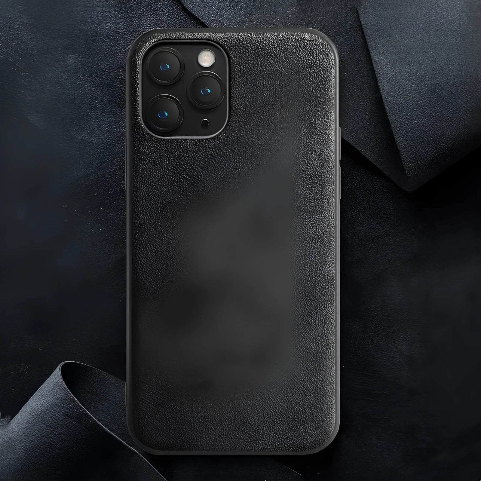 Suede mobile phone case for iPhone in elegant black, dark night green, and dark blue colours.