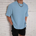 A man's loose-fit solid colour t-shirt in a slim style with short sleeves and a round neck.