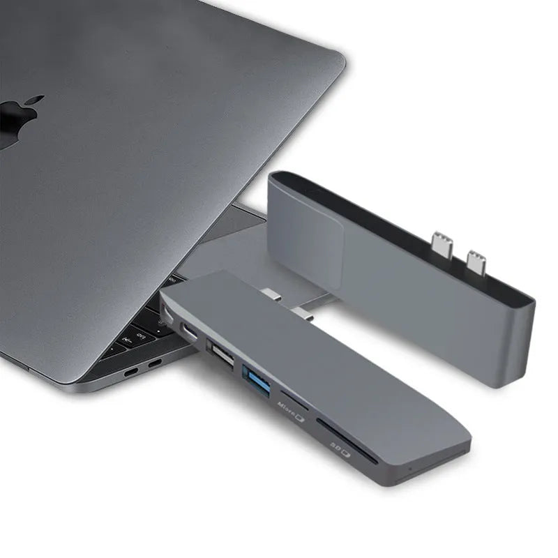 USB-C expansion hub with dual connectors for 2015-2018 MacBook Pro showing eight interface ports