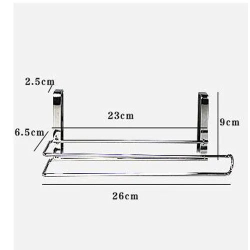 Silver stainless steel paper towel rack hanging on the back of a kitchen cabinet door.
