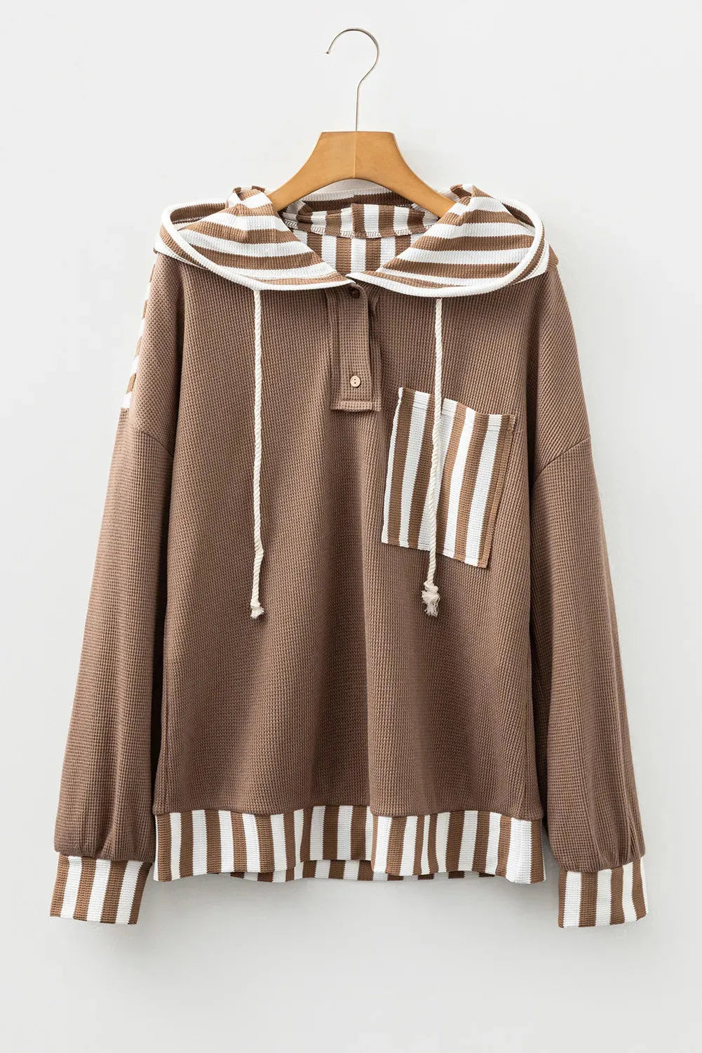 Straw yellow waffle texture hoodie with striped patchwork panels and button neck closure