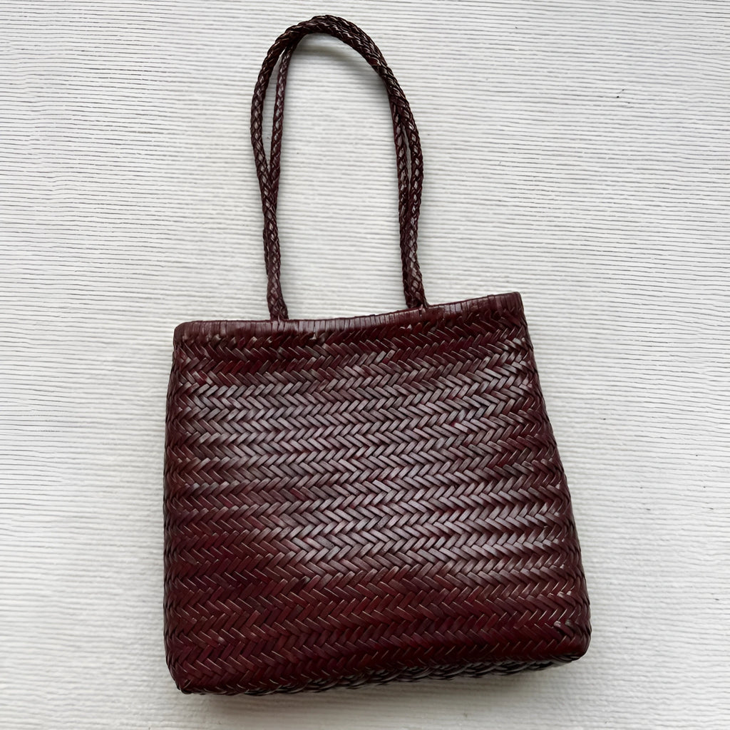 Handmade vintage woven leather shoulder bag in brown with three-dimensional pockets