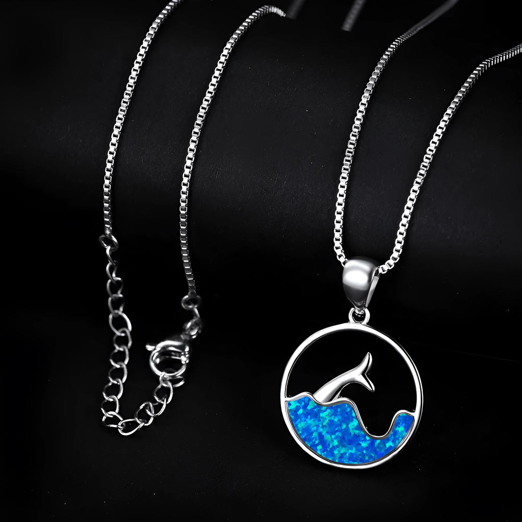 White gold electroplated copper fishtail necklace with geometric design and round opal elements