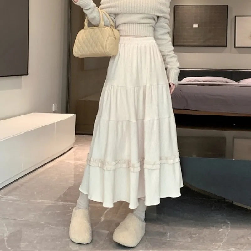 Corduroy A-line midi skirt with elastic waistband in beige, black, or brown solid colour