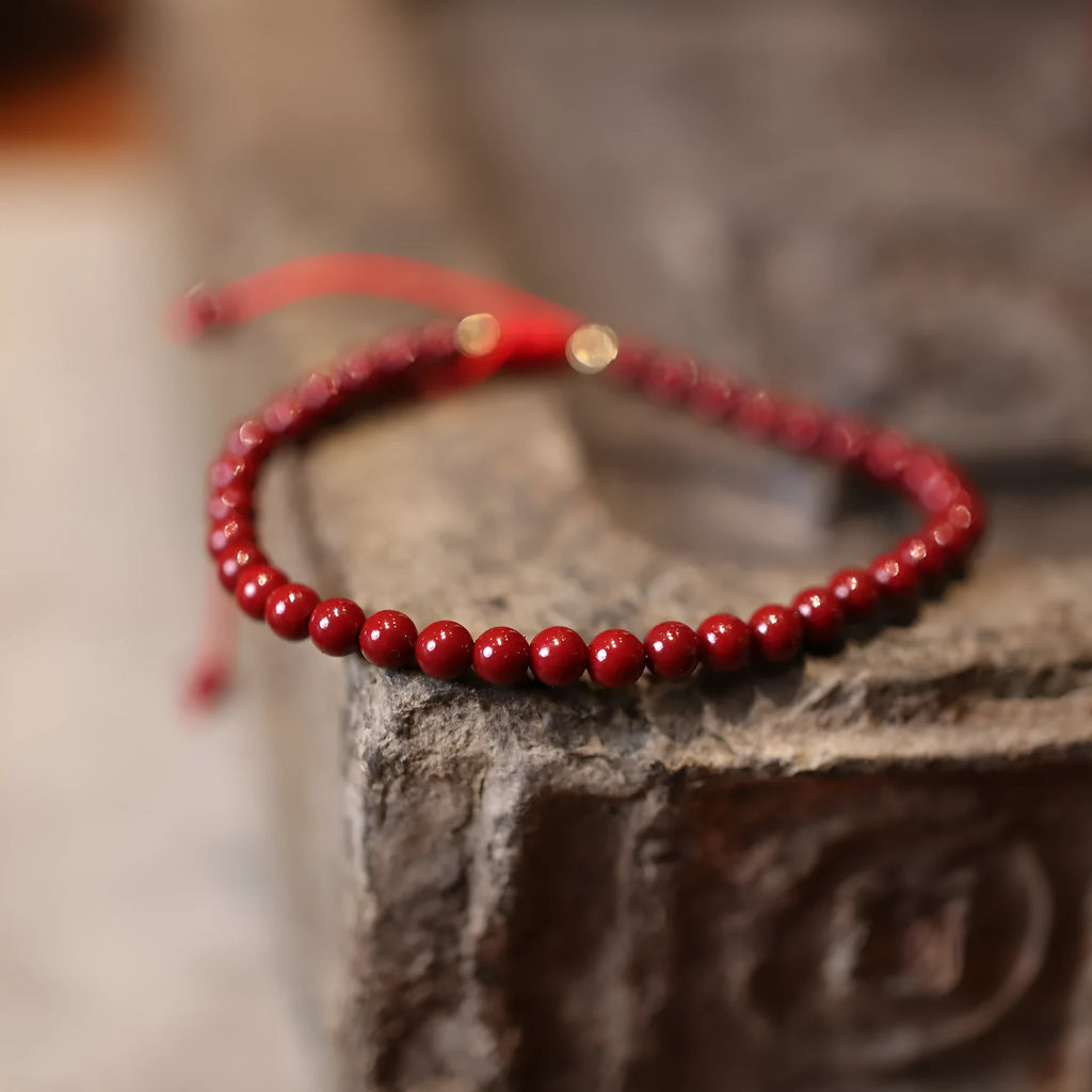 Natural cinnabar bracelet with purple gold sand design and geometric shape featuring Chinese auspicious patterns