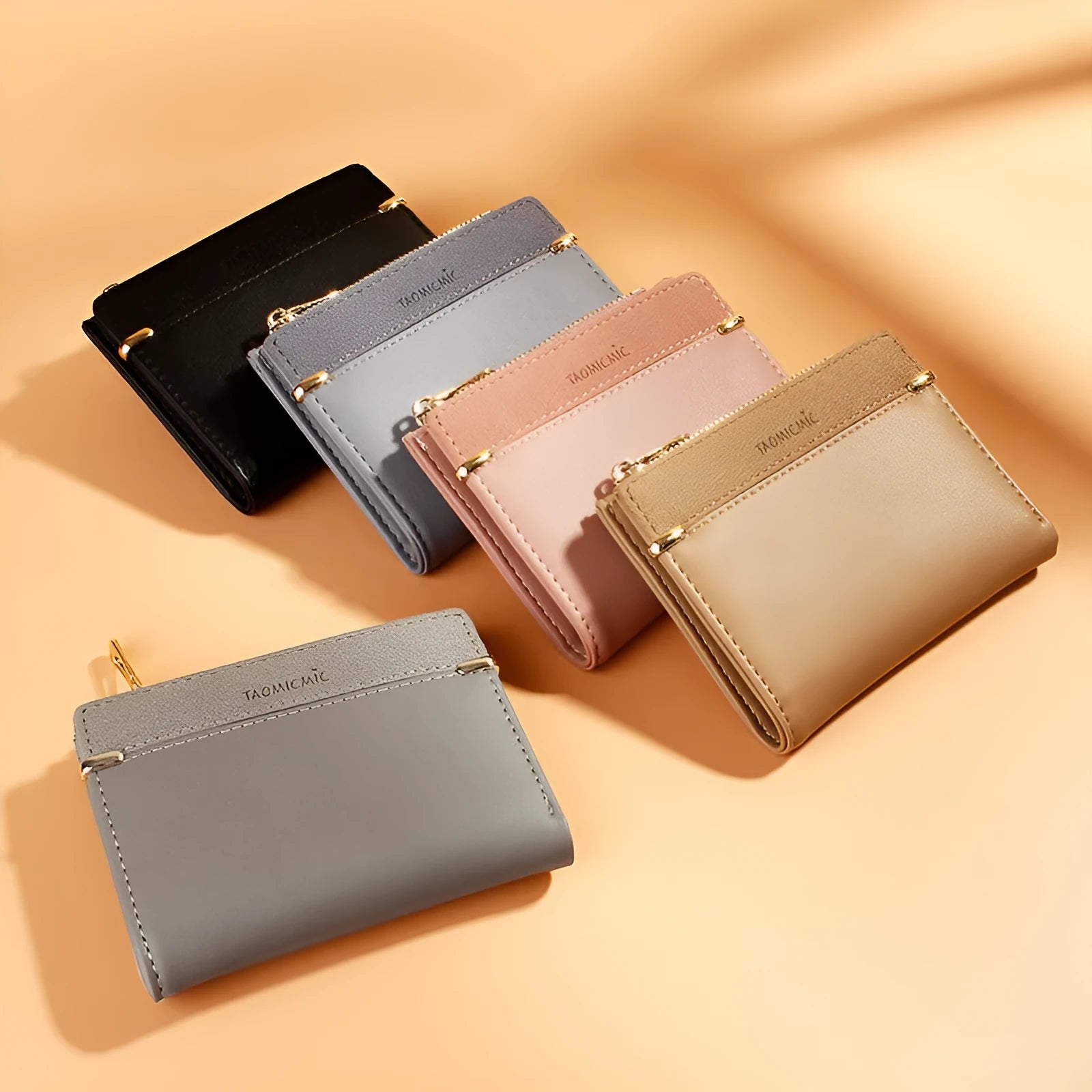 Open view of a short black PU leather ladies wallet showing multiple card slots, a zipper compartment, and a change pocket.