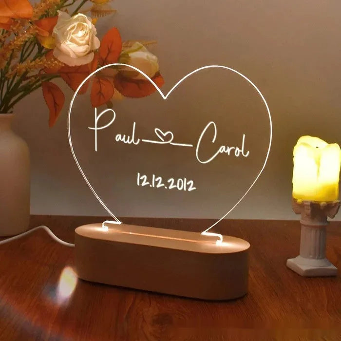 Custom acrylic LED night light displaying engraved names and dates on clear 20cm by 11.5cm panel