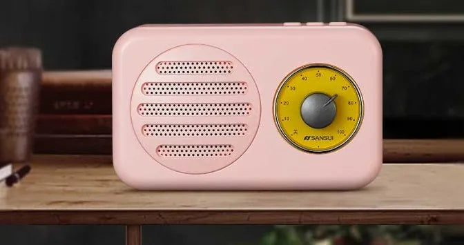 T1 portable Bluetooth speaker in wood grain pink with vintage finish, compact size, and FM radio support