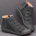 Women's casual flat booties with wedge heel and round toe in various colours including leopard print.