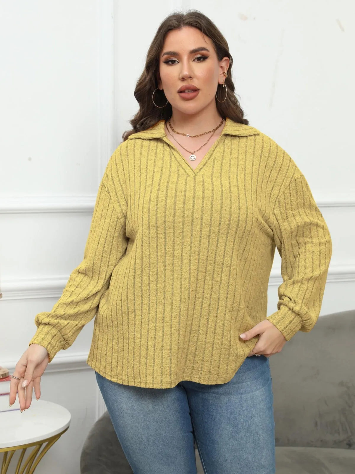 Women's plus size gray polo collar shirt with full lantern sleeves in a street fashion style.