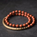 Layered retro ethnic bracelet featuring natural red jasper, obsidian, and water grass agate stones with brass elements