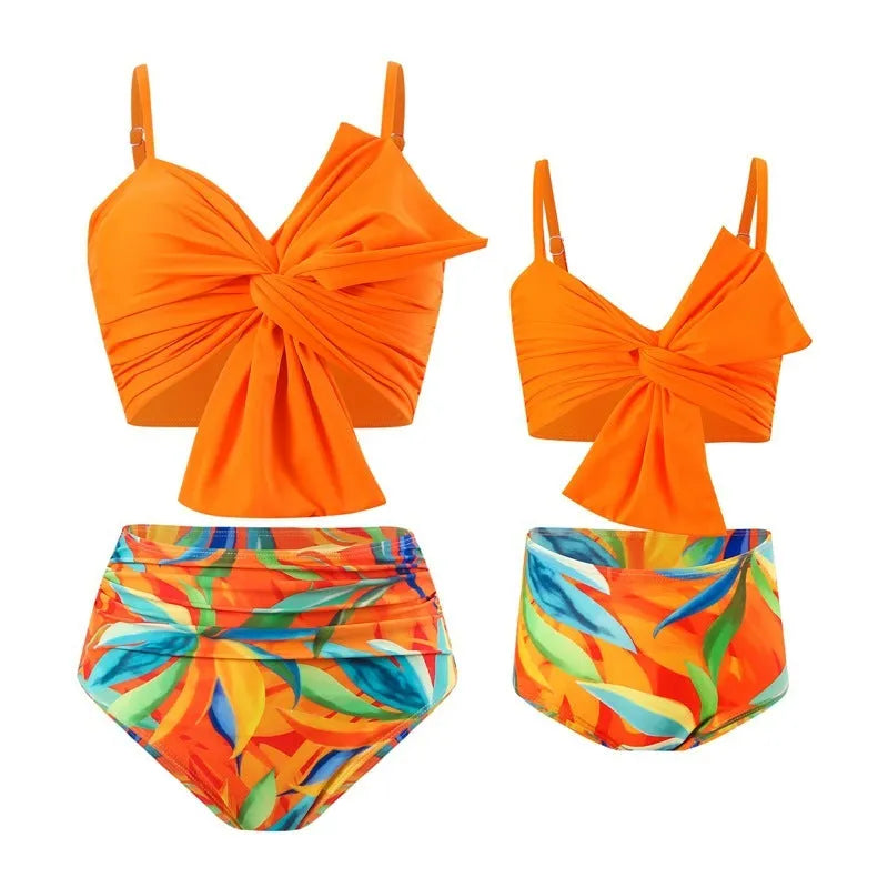 Women's big bow bikini print swim trunks set in orange, nylon fabric, matching top and bottom