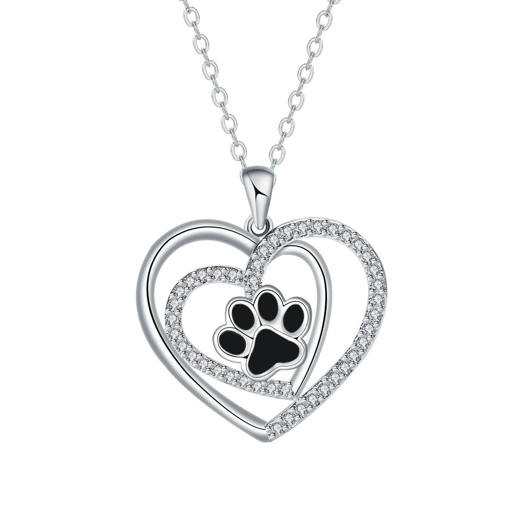 Original design women's necklace with copper dog paw print pendant on a cross chain.