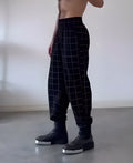 Men's plaid trousers with apron-style front panel in various sizes